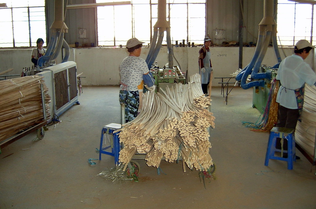 Bamboo Flooring Splines being sized before assembled into a floor.